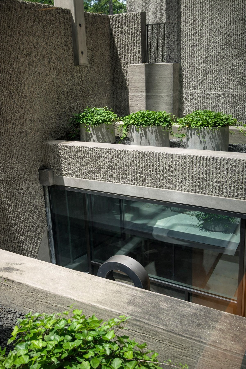 Concrete courtyard with planters.